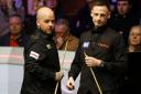 Luca Brecel leads Dave Gilbert after the opening session of their World Championship match in Sheffield (Richard Sellers/PA)