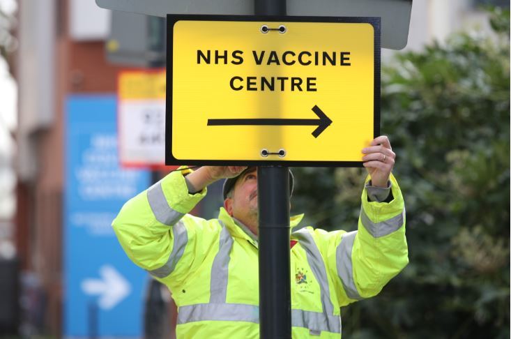 File photo of a sign to a Covid vaccination centre. Credit: PA