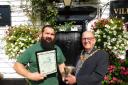 Epping Town Mayor Michael Wright presents the Epping in Bloom rose bowl to Theydon Oak landlord Iain Moran. Photo credit: David Jackman