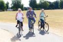 Left to right: Enfield resident Cathy Garnsworthy, Cllr Rick Jewell and Enfield resident, Mary Murphy, enjoy cycling in Bush Hill Park. Picture: Enfield Council