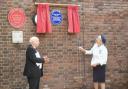 Geoffrey Hooper watches on as Jennifer Tolhurst unveils the Blue Plaque