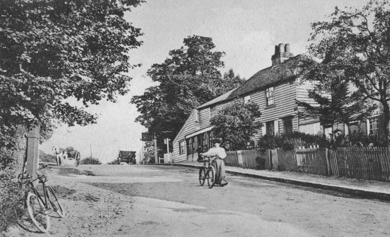 A view of Kings Head Hill which took its name from the inn that has stood at the top of the hill since at least 1782. On the right was Chingford’s letter sorting office from 1858 but better known as Pracy’s sweetshop after the war. A cottage