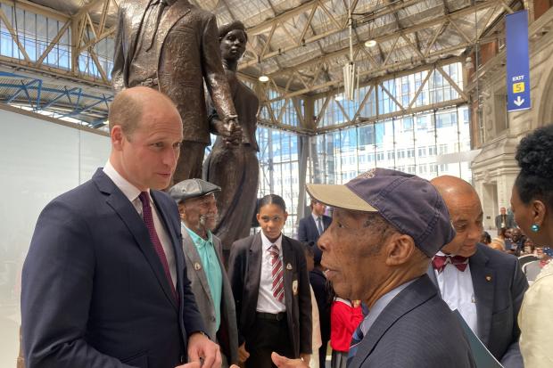 Siggy Cragwell speaks to Prince William at the unveiling of the National Windrush Monument