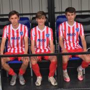 Seating - Three members of Buckhurst Hill Football Club’s youth team try out the new stand