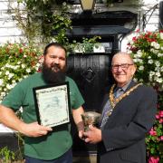 Epping Town Mayor Michael Wright presents the Epping in Bloom rose bowl to Theydon Oak landlord Iain Moran. Photo credit: David Jackman
