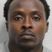 Nana Oppong, 41, is wanted by Essex Police for the drive-by killing of Robert Powell