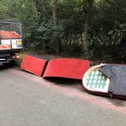 The dumped sofa in Epping Forest. Credit: SWNS/City of London Corporation