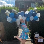Cheyanne after the haircut with balloons donated by L&E party event hire