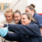 Visit - Sir Rod Stewart taking pictures with nurses and patients