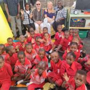 Gambian school children with Chris Bialan (British sponsor) and Julie Maio