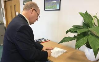 Harlow Council’s chair, councillor Andrew Johnson, signing the letter of condolence. Credit: Harlow Council