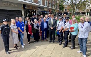 Representatives of Essex Police, Harlow Council and the NHS join local business owners and residents in The Stow